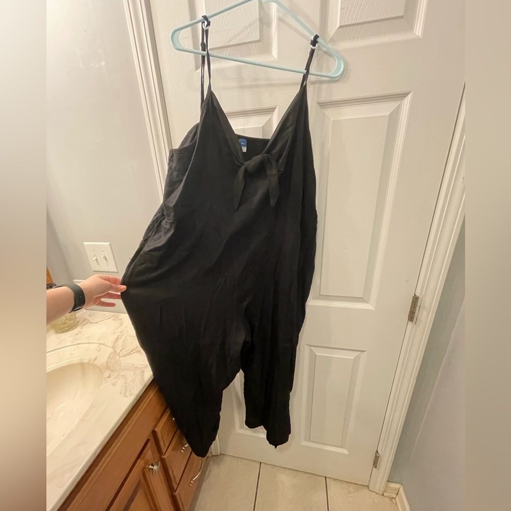 Black jumpsuits with a tie in the front and pockets